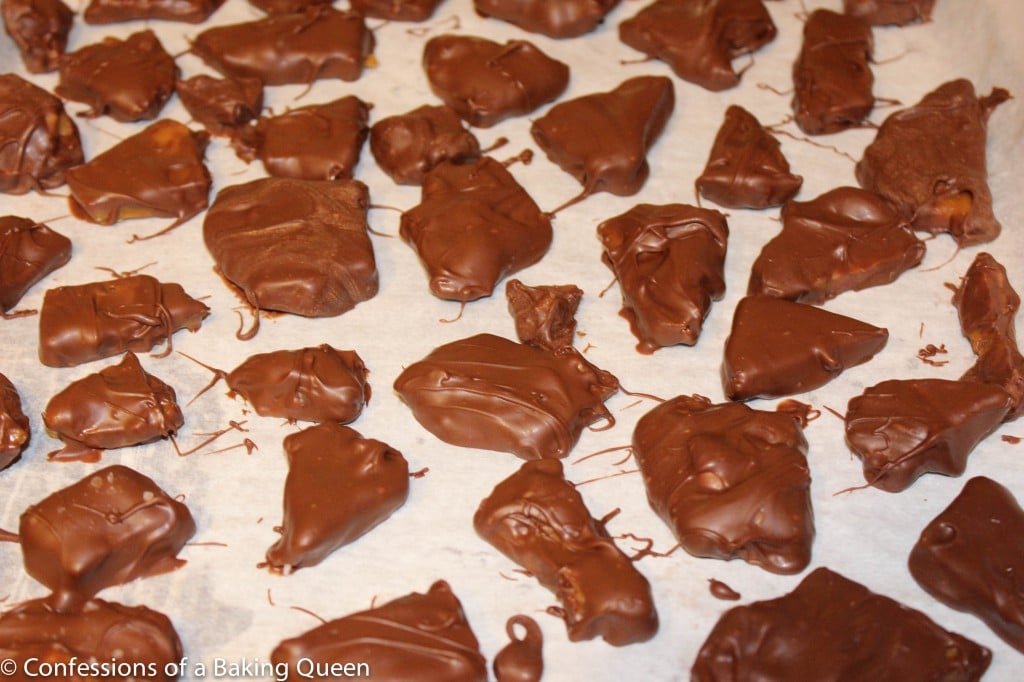 set Toffee Brittle Dipped in Milk Chocolate on a piece of parchment paper
