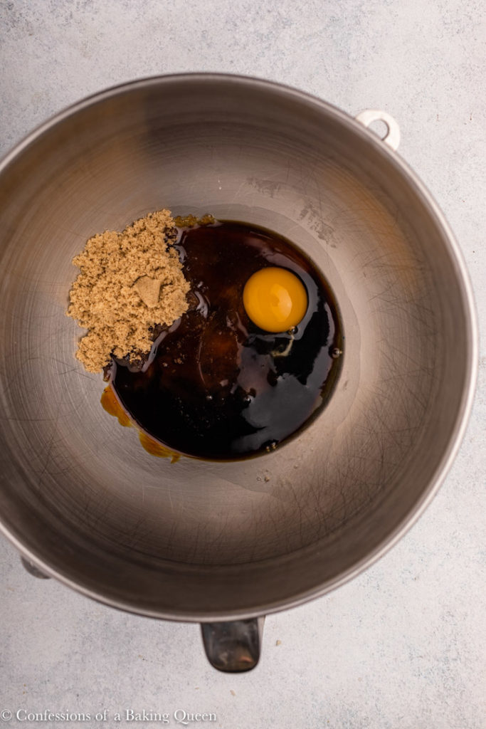 brown sugar, eggs, vanilla, and molasses in a metal mixing bowl