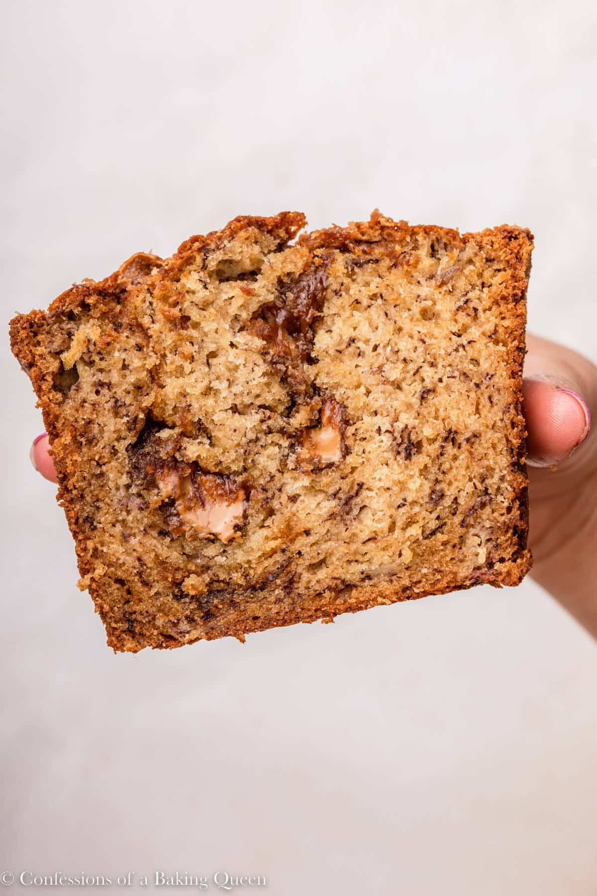 close up of cookie butter banana bread held up to the camera