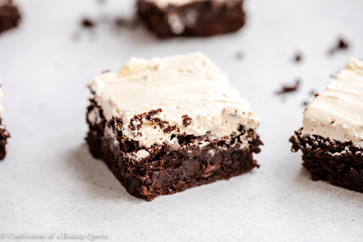 guinness brownies with baileys frosting on white surface
