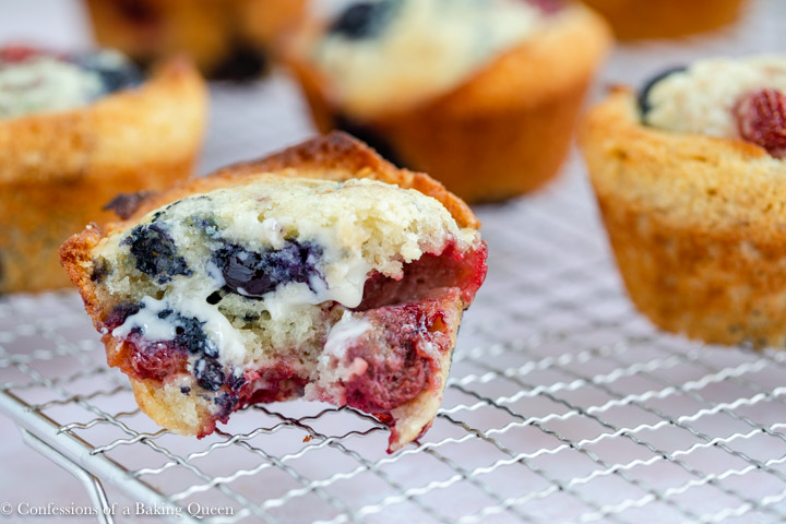 strawberry blueberry muffins on a wire rack
