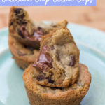 Truffle Stuffed Chocolate Chip Cookie Cups baked, stacked on top of each other on a blue plate