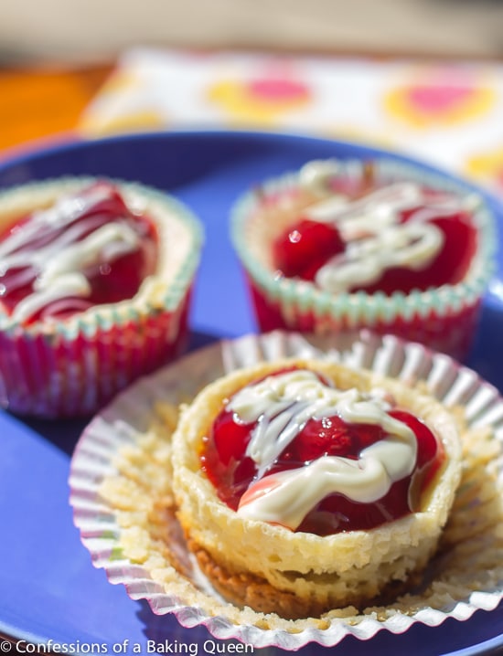 White Chocolate Cherry Cheesecakes on a blue plate