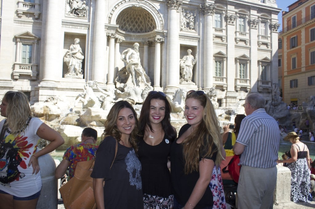 three girls in front of the trevy fountain
