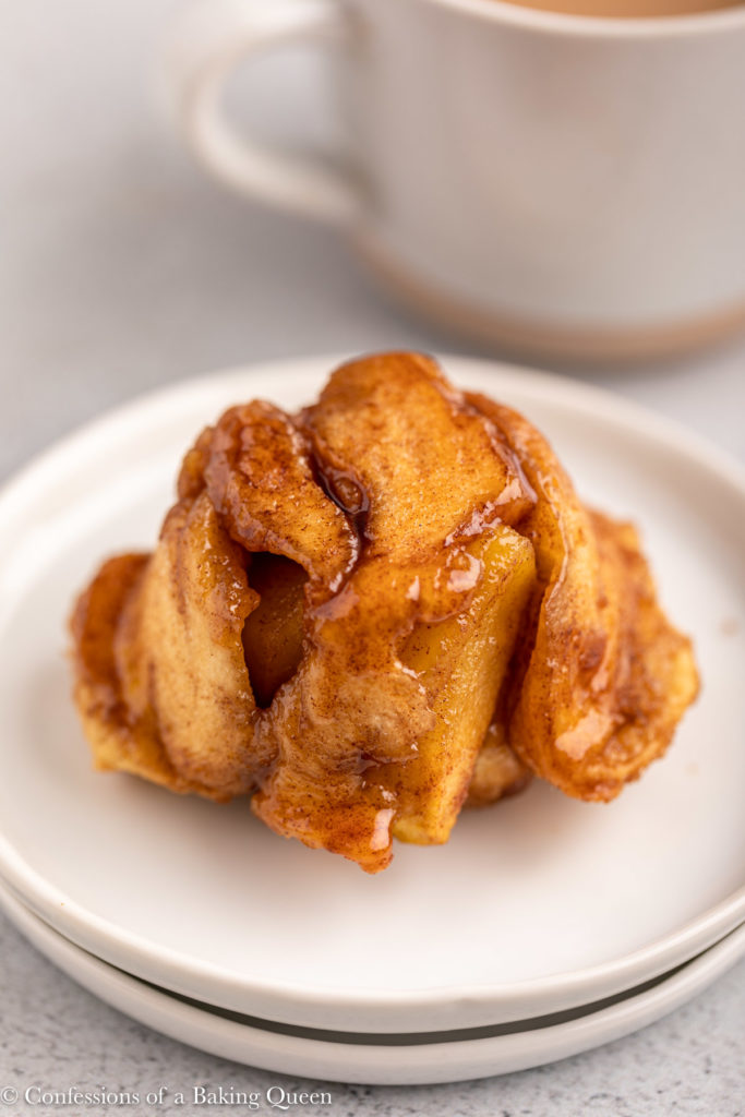 close up of an apple monkey bread on a white plate