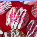 overhead shot of Strawberry Red Velvet swirl cookies on a red cake plate