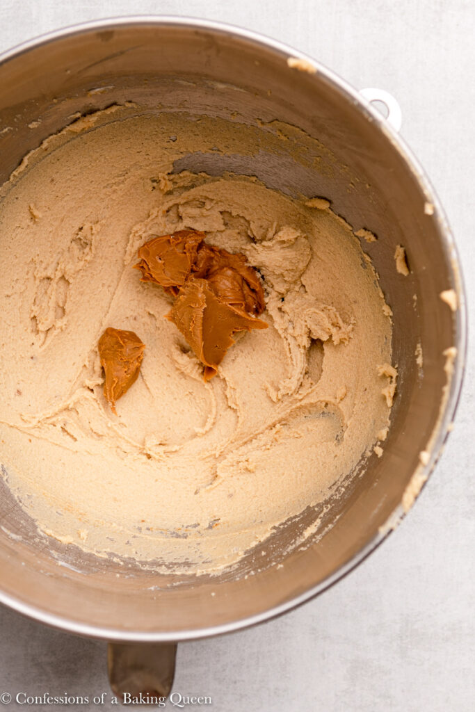 cookie butter added to creamed butter and sugar in a large mixing bowl