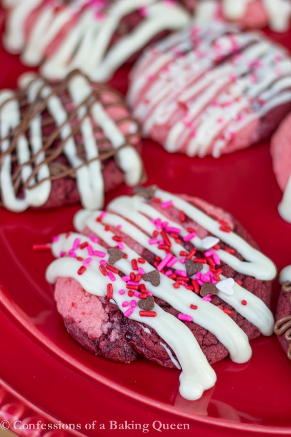 Close Up of Strawberry Red Velvet Swirl Cookies on a red plate 