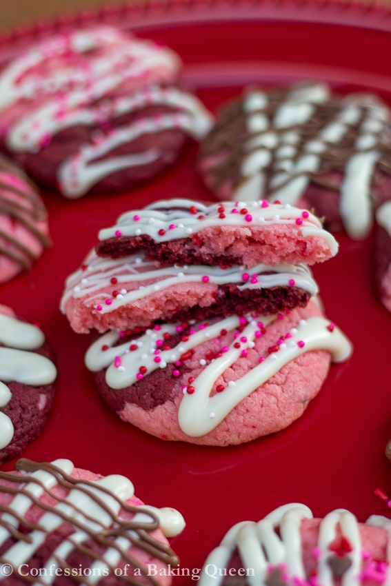Strawberry Red Velvet Swirl Cookies on a red cake plate 