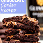 guinness chocolate cookies stacked with oozing chocolate on a white surface with a bottle of Guinness in the background