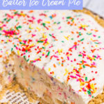 golden oreo cake batter ice cream pie in a white and brown pie dish