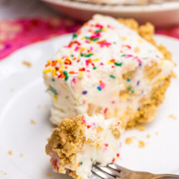 Golden Oreo Cake Batter Ice Cream Pie served on a white plate