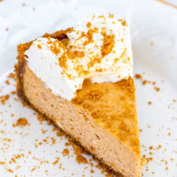 pumpkin cheesecake slice on a cream plate