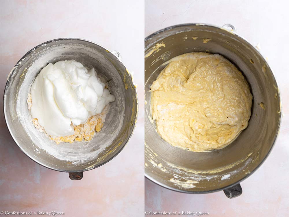 egg whites added to cake batter and folden in inside a metal mixing bowl on a light pink surface