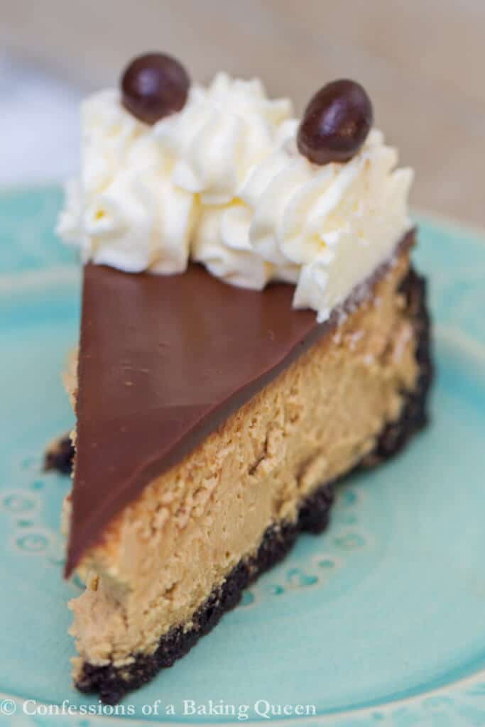 Coffee Cheesecake slice on a blue plate on a light grey surface