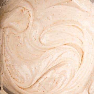 browned butter cream cheese frosting in a metal mixing bow