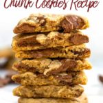 ultimate chocolate chunk cookies broken open and stacked on top of each other on white marble