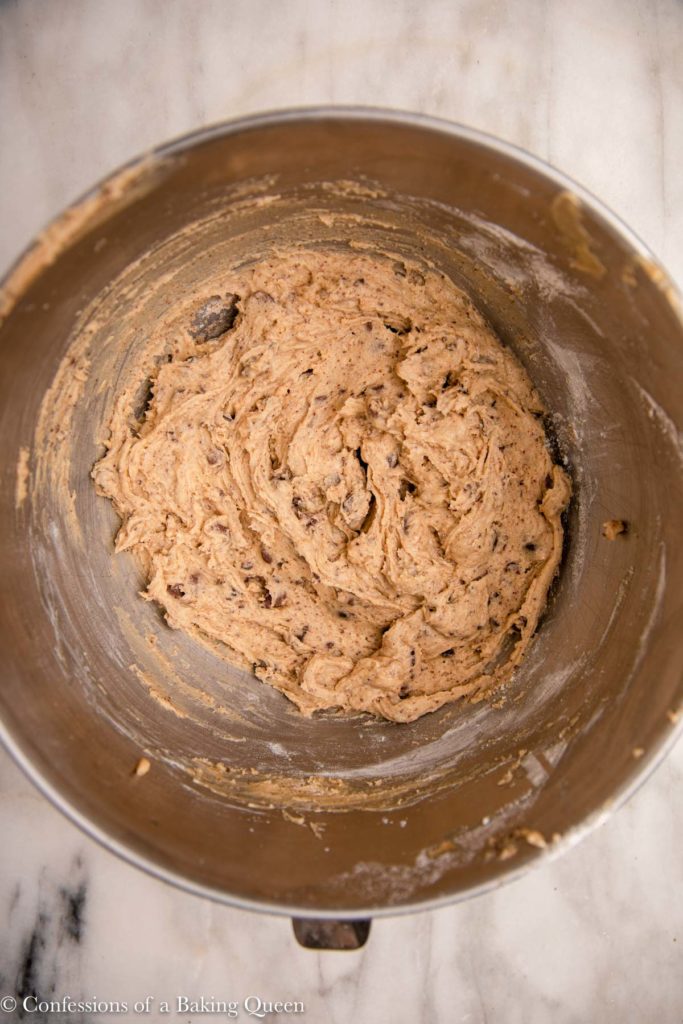 ultimate chocolate chip cookie dough in a metal mixing bowl