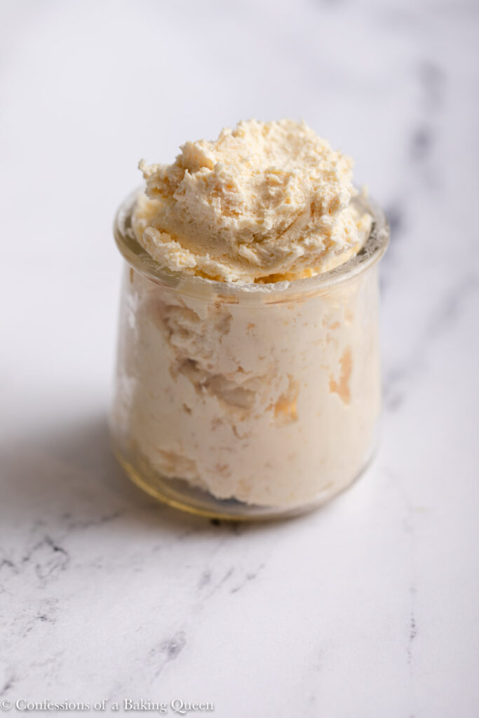 jar of clotted cream on a marble surface