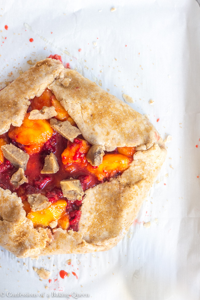 Peach Raspberry Galette ready to be baked on parchment paper