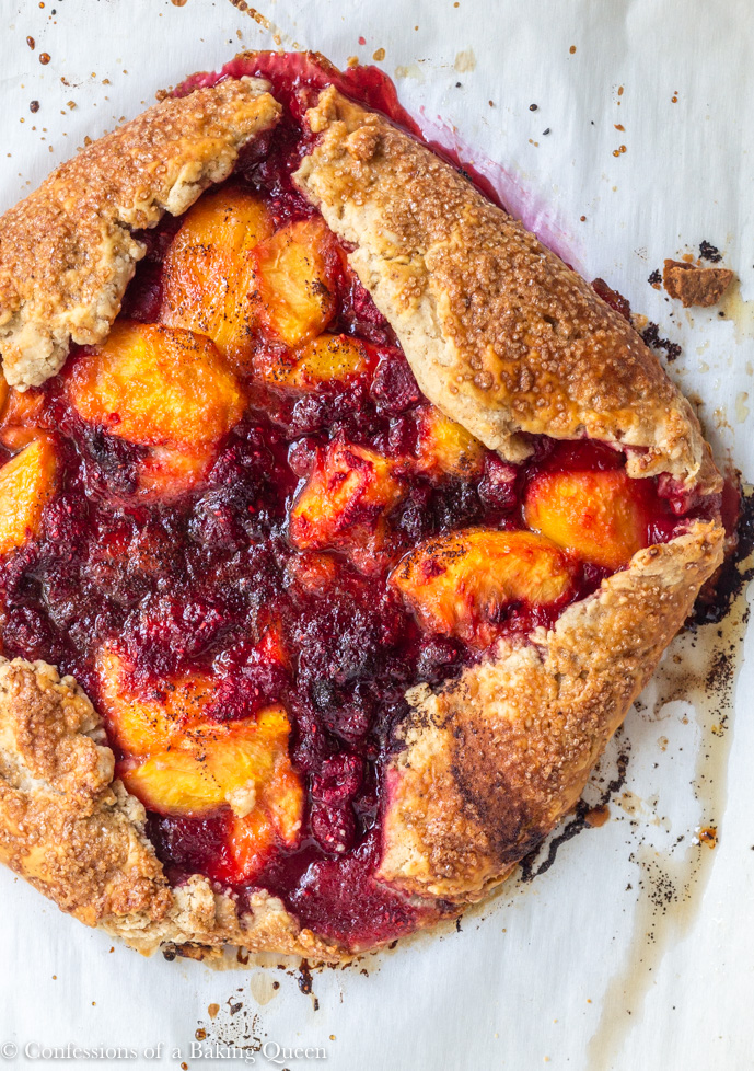 just baked Peach Raspberry Galette Recipe cooling on parchment paper