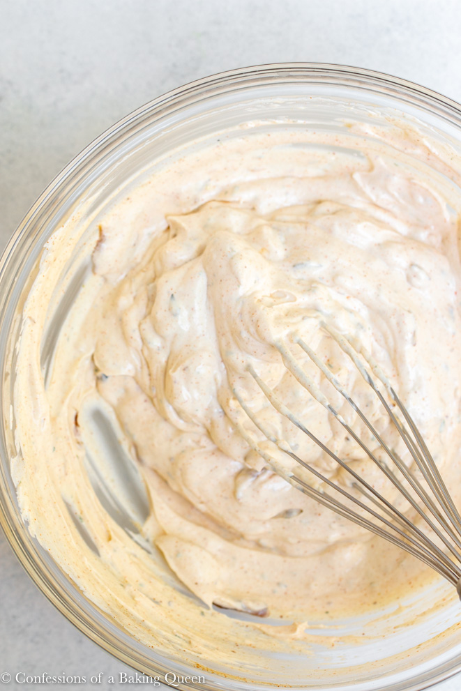 how to make french onion dip ingredients whisked together in a large clear bowl