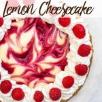 raspberry swirl lemon cheesecake on a cake stand