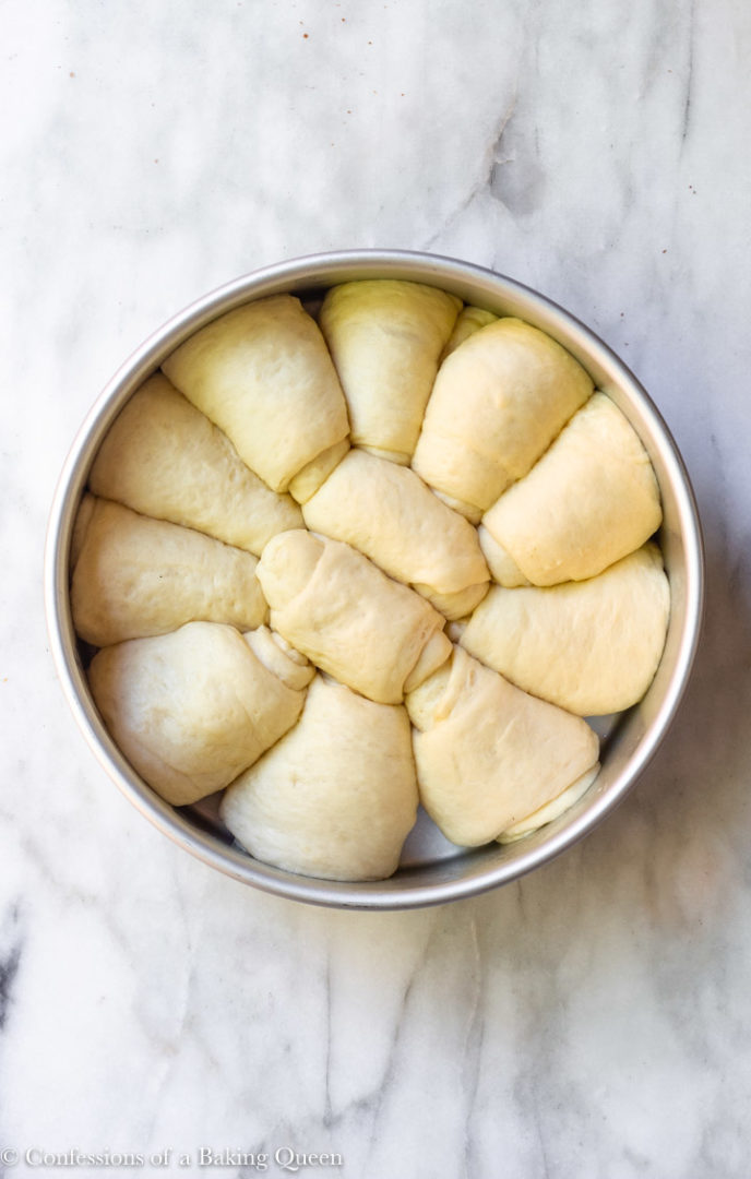 Dinner Rolls From Scratch in a circle metal pan before baking