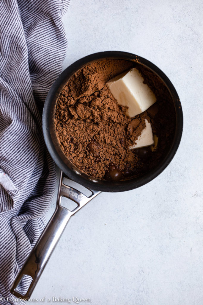 butter and cocoa powder in a small pot for a chocolate peppermint brownie recipe