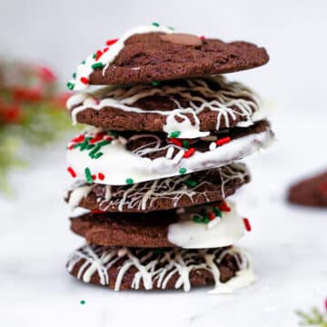 Chocolate Peppermint Cookies stacked high on a marble surface
