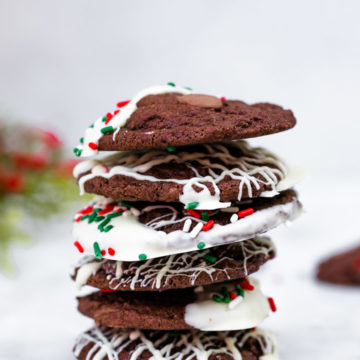 Chocolate Peppermint Cookies stacked high on a marble surface