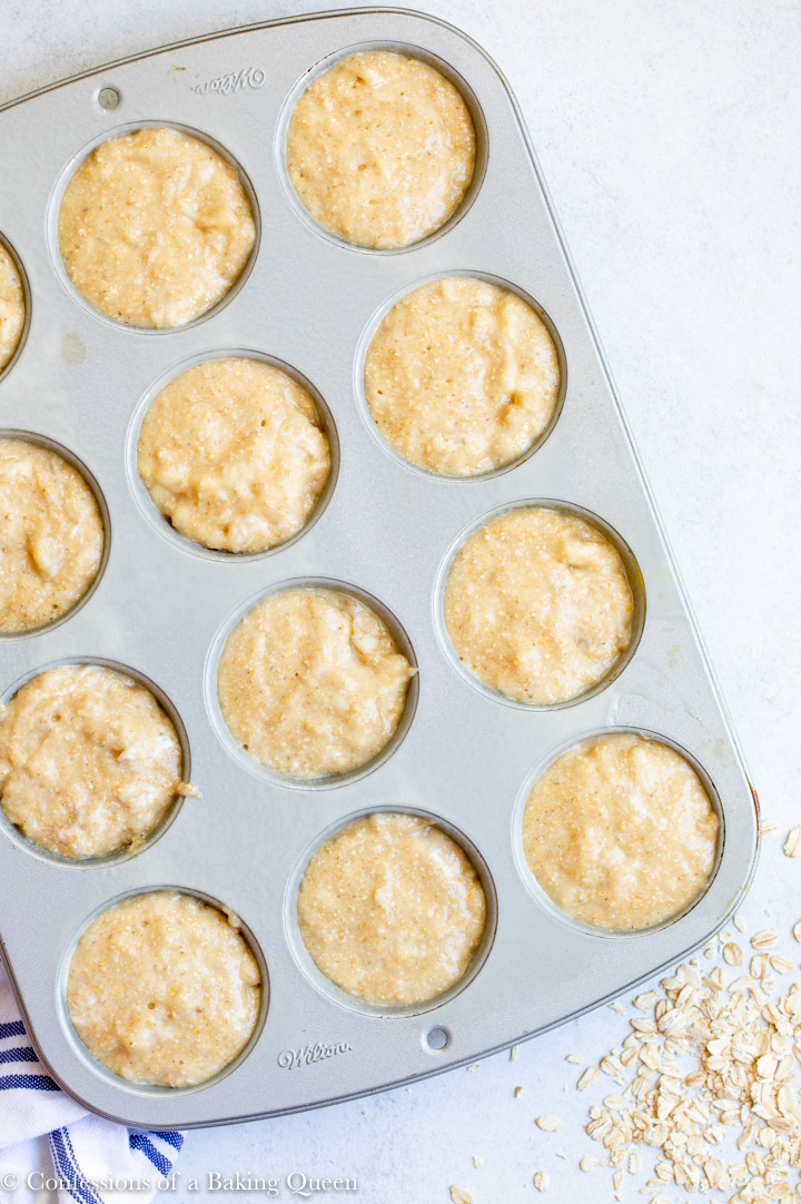 oat flour banana muffins in a metal cupcake tin