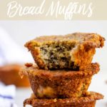 oat flour banana bread muffins stacked on top of each other on a white marble surface
