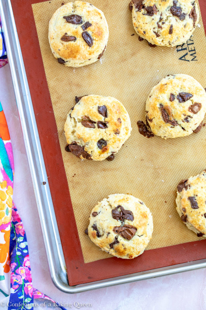 chocolate chunk scones baked on a silpat lined baking sheet