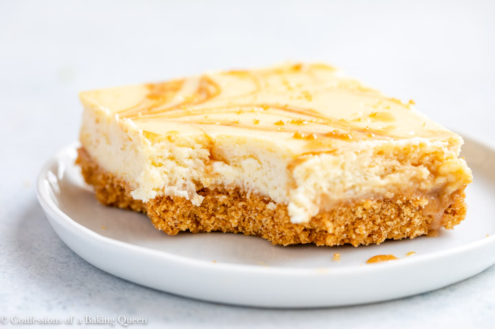 close up of a dulce de leche cheesecake bar on a white plate