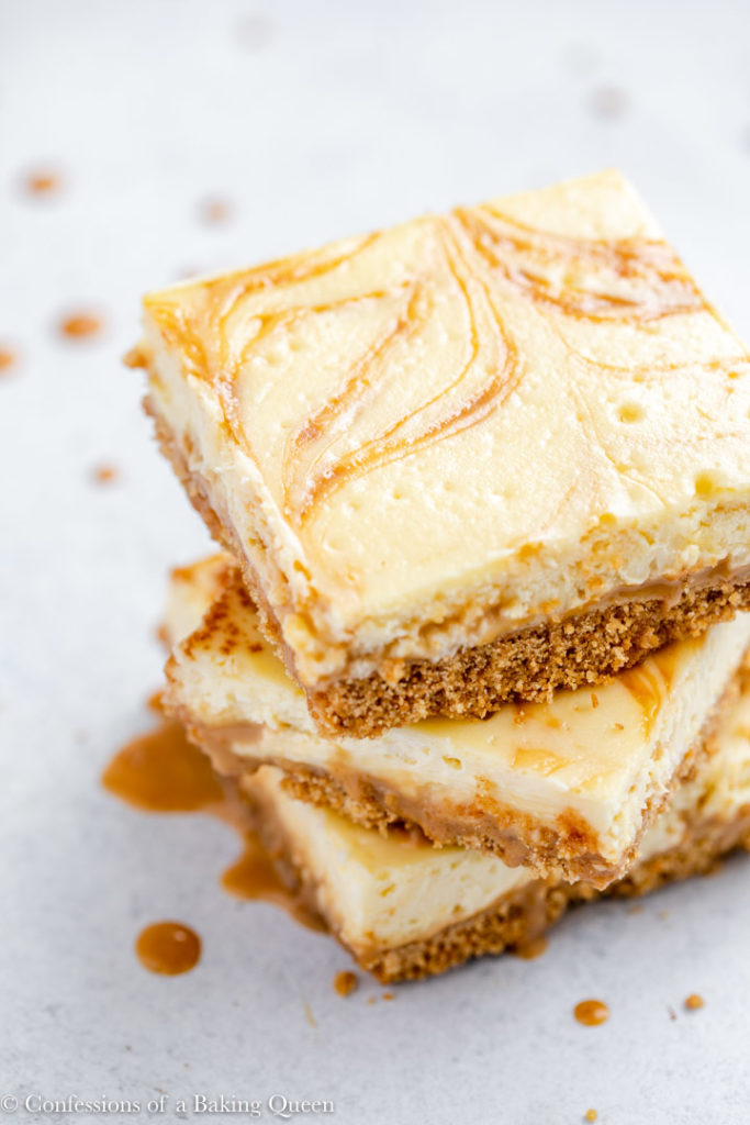 overhead view of three cheesecake bars stacked on top of each other