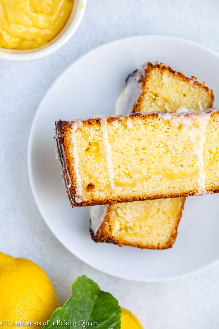 lemon curd lemon loaf cake stacked on top of each other on a white plate