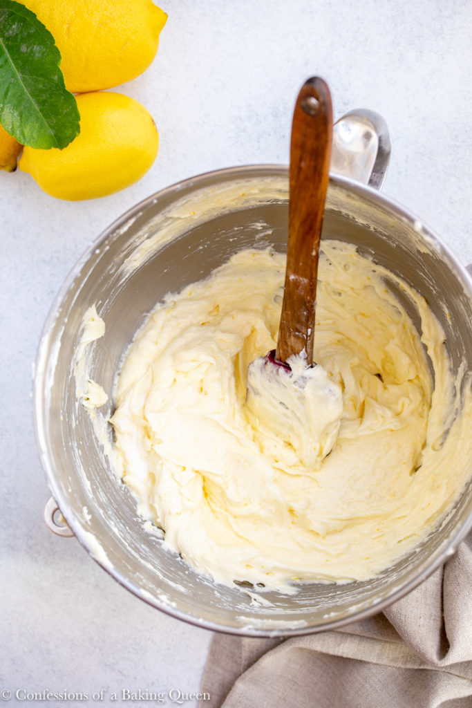 lemon juice added to wet ingredients in a metal mixing bowl