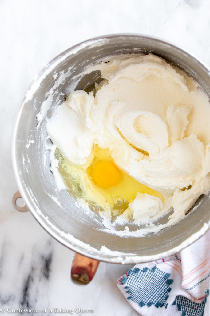 egg added to butter sugar mixture in a large mixing bowl