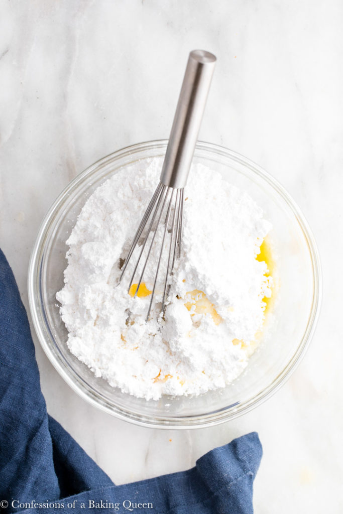 powdered sugar and orange juice in a small bowl