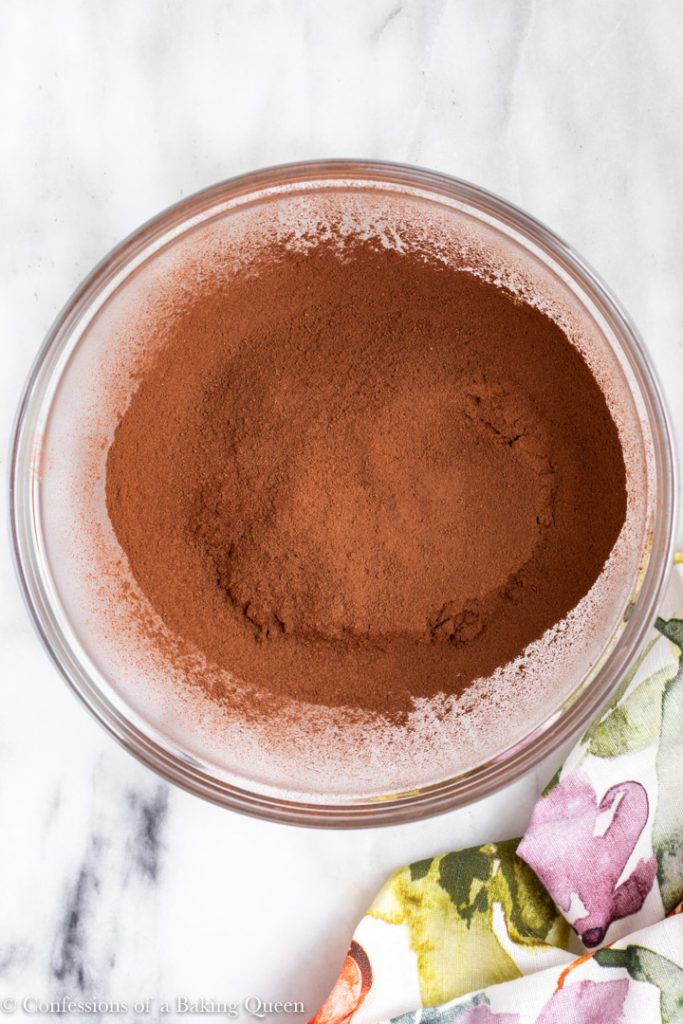 sifted cocoa powder in a large glass bowl