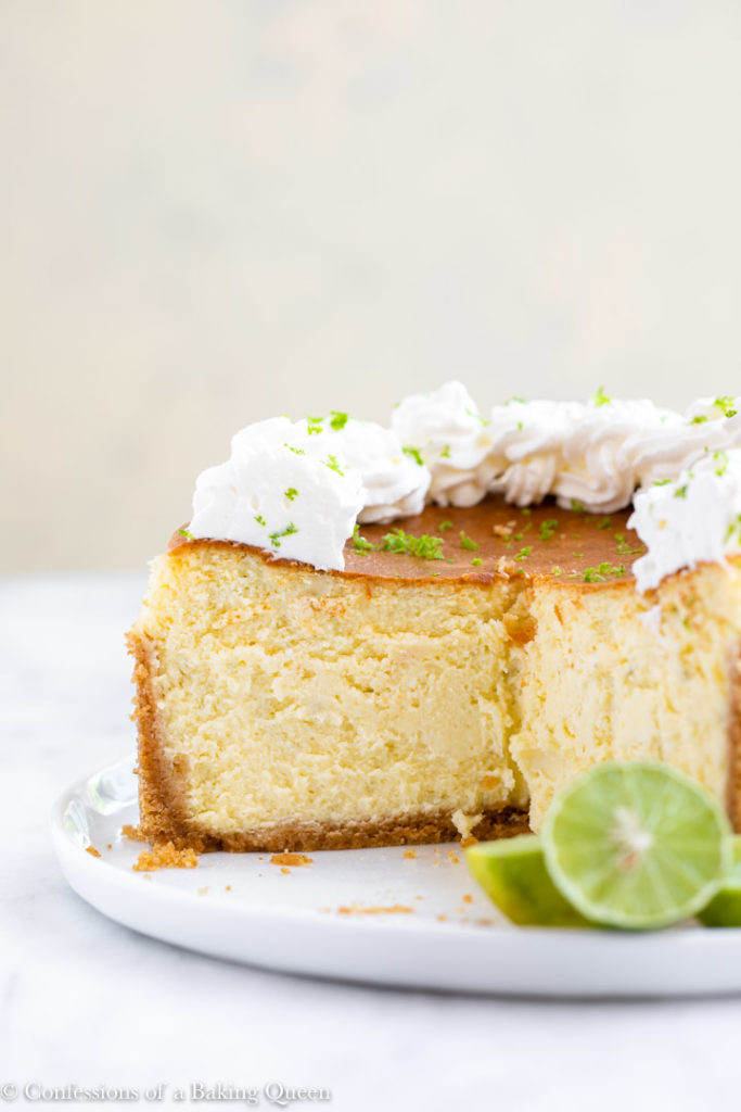 inside view of key lime cheesecake sitting on a white plate
