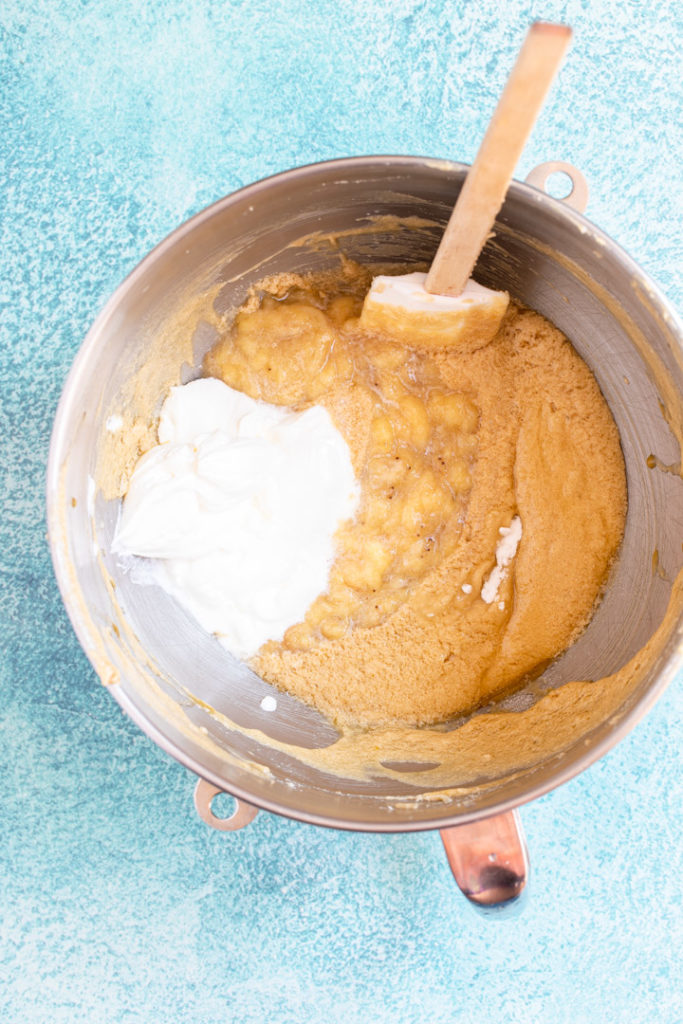 sour cream and mashed bananas added to the rest of the wet ingredients for a banana bread recipe