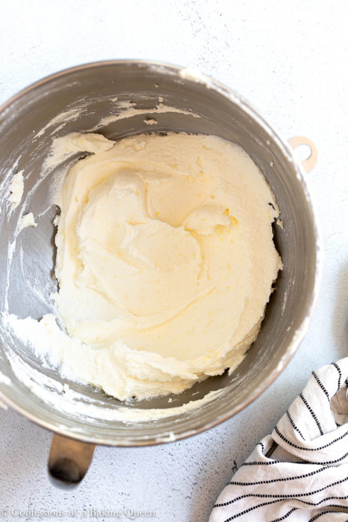 whipped butter sugar mixture in a metal bowl