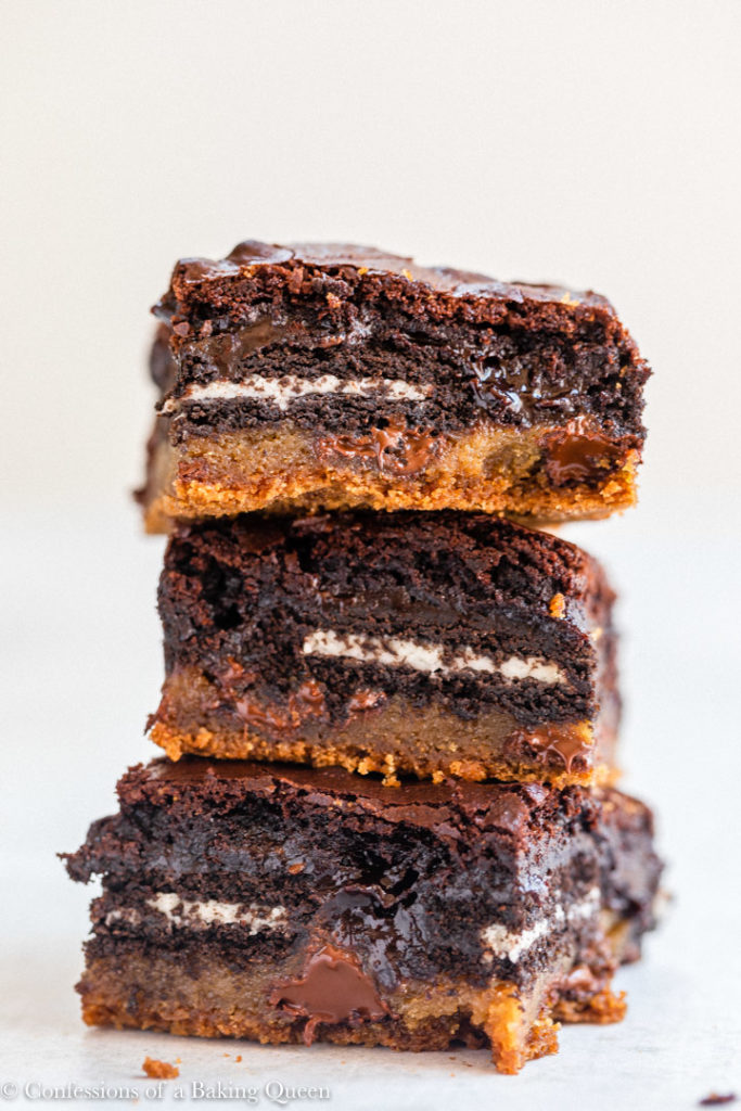 stack of slutty brownies on a white surface