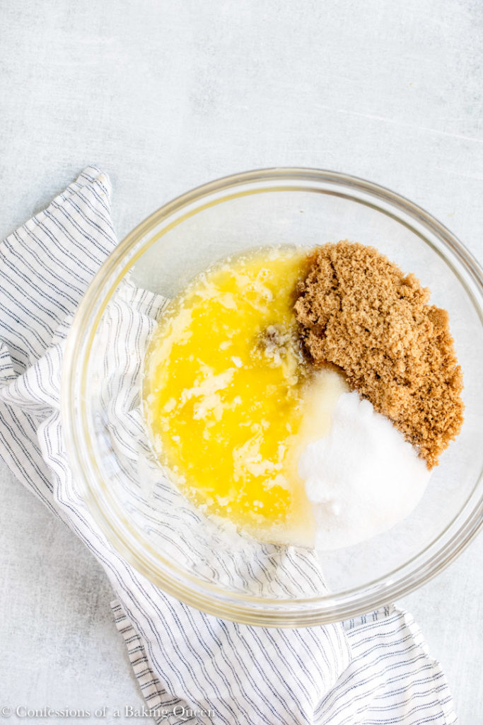 melted butter, granulated sugar, and brown sugar in a glass bowl