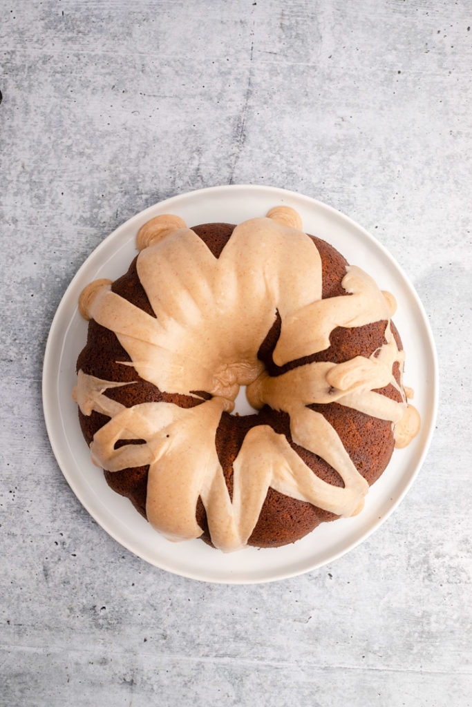 gingerbread bundt cake with a browned butter glaze on a white plate