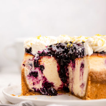 close up of the inside of a sliced lemon blueberry cheesecake