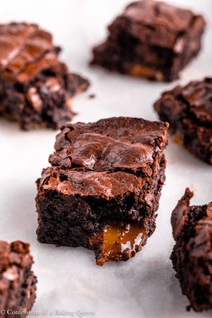 pieces of salted caramel brownies on a white counter
