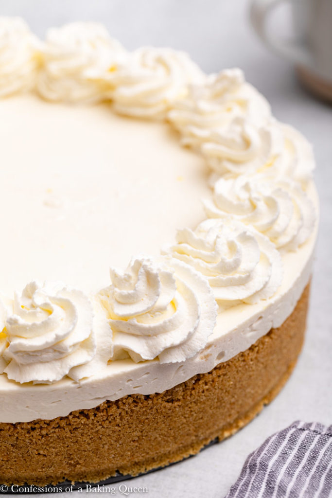 45 degree view of a no bake cheesecake with whipped cream